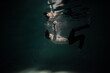 Beautiful underwater shooting, guy in white shirt and pants has fallen under the water and is drowning. a young man relaxes down under surface of the water, waves and refraction of light under water