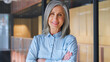 © Stock 4 You - Portrait of smiling confident 60-s gray-haired mature woman.