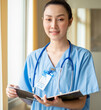 © Nassorn - Woman doctor person wears uniform and stethoscope reading document of patient information for surgery consultation. Asian female professional nurse is working as healthcare consultation in hospital