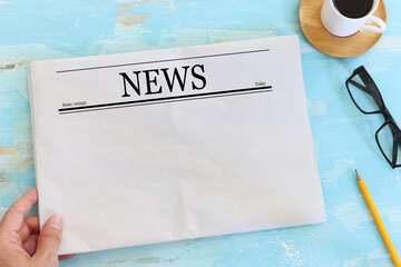 Top view image of empty newspaper over wooden table