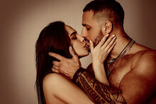Young Couple In Love Spends Time Together. Man Embracing And Going To Kiss Sensual Woman.