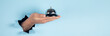 © ARAMYAN - man holding hotel ring bell