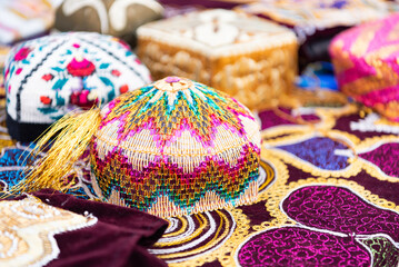 Traditional national headdress of the eastern peoples of the world. Festival of nationalities with display of hats. Elements of clothing with bright ornaments and patterns.