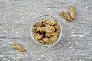 Wall Mural - Peanut on old white wood background