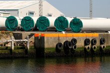 Wind Turbine Sections Stored At A Coastal Port Location