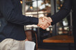 © prostooleh - Portrait of cheerful young manager handshake with new employee.