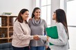 © Krakenimages.com - Three woman patient and psychologist shake hands at psychology center