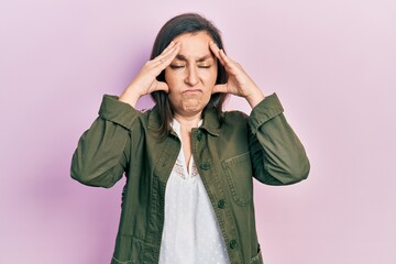 Canvas Print - Middle age hispanic woman wearing casual clothes suffering from headache desperate and stressed because pain and migraine. hands on head.