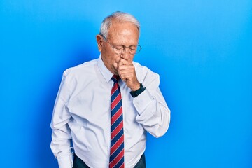 Canvas Print - Senior man with grey hair wearing business suit and tie feeling unwell and coughing as symptom for cold or bronchitis. health care concept.