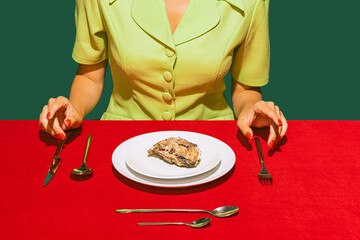 Wall Mural - Cropped image of woman eating oyster on red tablecloth isolated over green background