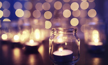 Background With Candles In Glass Vessels. Candles Burn In A Dark Place. Rest In Peace.