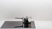 Saucepan on a glass-ceramic induction stove hob