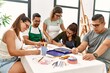 © Krakenimages.com - Group of draw students sitting on the table drawing at art studio.