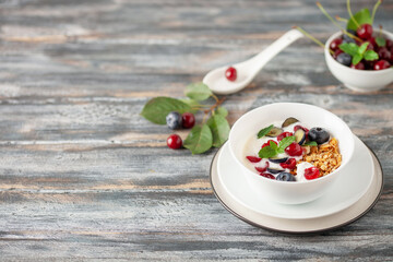 Wall Mural - Cherry and blueberry granola with yogurt. Healthy food, diet breakfast.