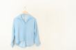 © topntp - beautiful woman shirt hanging on wall