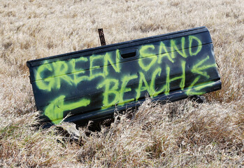 Green sand beach sign 