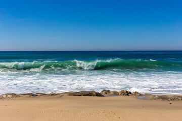 A view on Pacific ocean with blue water and waves