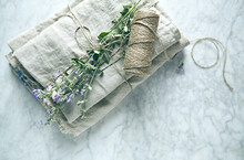 Folded Linen Cloths With Catnip Flowers. Top View