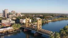 Panning Aerial Shot Of The Tower Bridge With Downtown Sacramento In The Background. 4K