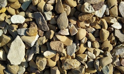 Abstract background with lot of various shape peeble stones. 