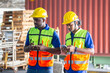 © JU.STOCKER - Warehouse worker in the hard hat uses mobile phone, Men using smartphone