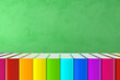 Ready for school concept with books in rainbow colors and blackboard background