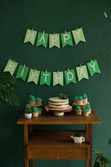 Wall Mural - Birthday party table decoration, Happy Birthday inscription and baking