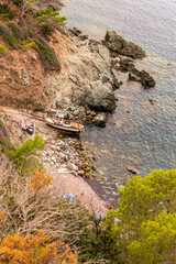 Wall Mural - Fishing boat at Ogliera beach, a little wild free beach near Pomonte 