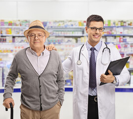 Canvas Print - Mature man and a phamracist standing in a chemist