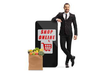 Sticker - Businessman leaning on a smartphonewith text shop online written on the screen