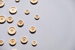 © MediaSoul - many buttons. Many buttons of different sizes on a gray background, free space. Sewing materials. Sewing