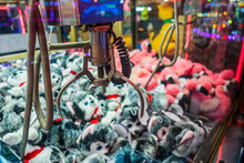 Fairground attraction catching stuffed toys 