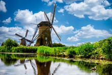 Traditional Windmills By A Canal, Holland