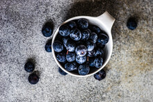 Close-up Overhead View Of A Bowl Of Fresh Blueberries On A Table