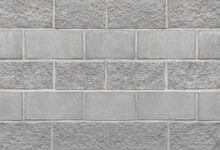 Grey Wall Made Of Rectangular Concrete Blocks Of Different Structures