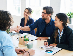 Wall Mural - Business people shaking hands in office meeting after successful partnership deal for startup company