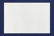 © nikol85 - Texture of craft white color paper background with navy blue border, macro. Structure of vintage dense kraft cardboard