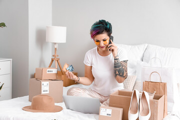 Sticker - Beautiful woman with credit cards shopping online in bedroom