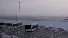Abu Dhabi International Airport Terminal With Passengers And Plane