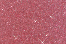 Sparkling Texture. Abstract Pink Background With Sparkles In The Shape Of Stars. Festive Backdrop For Your Projects.