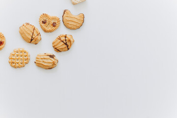 Poster - Top view different cookies on table top, Flat lay of various cookies on white background