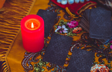 Magical scene, esoteric concept, fortune telling, tarot cards on a table	