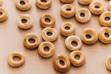 Wall Mural - Fresh bagel on brown background