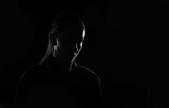 Fototapete - Female person silhouette in the shadow, back lit light