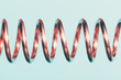 Beautiful macro close-up of twisted horizontal copper spring wire on a pastel light blue background.