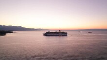 Costa Luminosa Cruise Ship During Early Bright Sunrise Near Shore Of Croatia