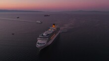 Large Costa Luminosa Cruise Ship Floating In Mediterranean Sea During Daybreak