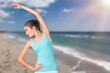 © BillionPhotos.com - Satisfied fitness slim woman doing exercises by the sea. Healthy habits and lifestyle