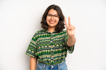 Wall Mural - hispanic pretty woman smiling and looking friendly, showing number two or second with hand forward, counting down