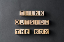 Think Outside The Box - Phrase From Wooden Blocks ., Think Imaginatively Using New Ideas Concept, Gray Background